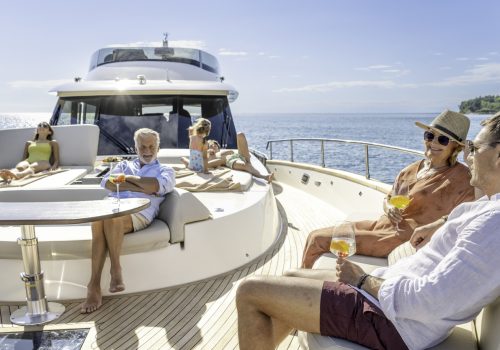 Multigenerational family enjoying cruise on yacht on sunny day