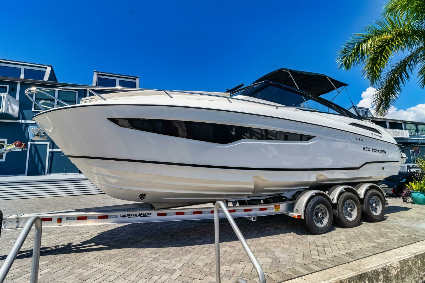 the Skamander 850 Voyager from Hussar Yachts, powered by twin 225 Mercury outboards. She has a full cabin and head, and is a performance machine with a cruising speed of 30 MPH and a fantastic ride.