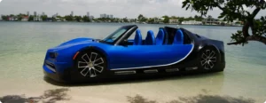 Blue luxury watersports car, four seat, speed boat, sitting on the shore. Series B Available at Pier One Yacht Sales